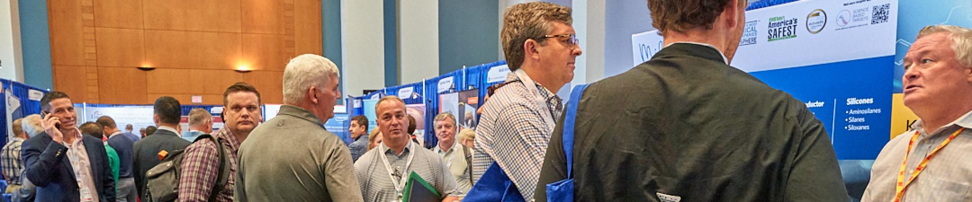 Representatives gather at booths to network